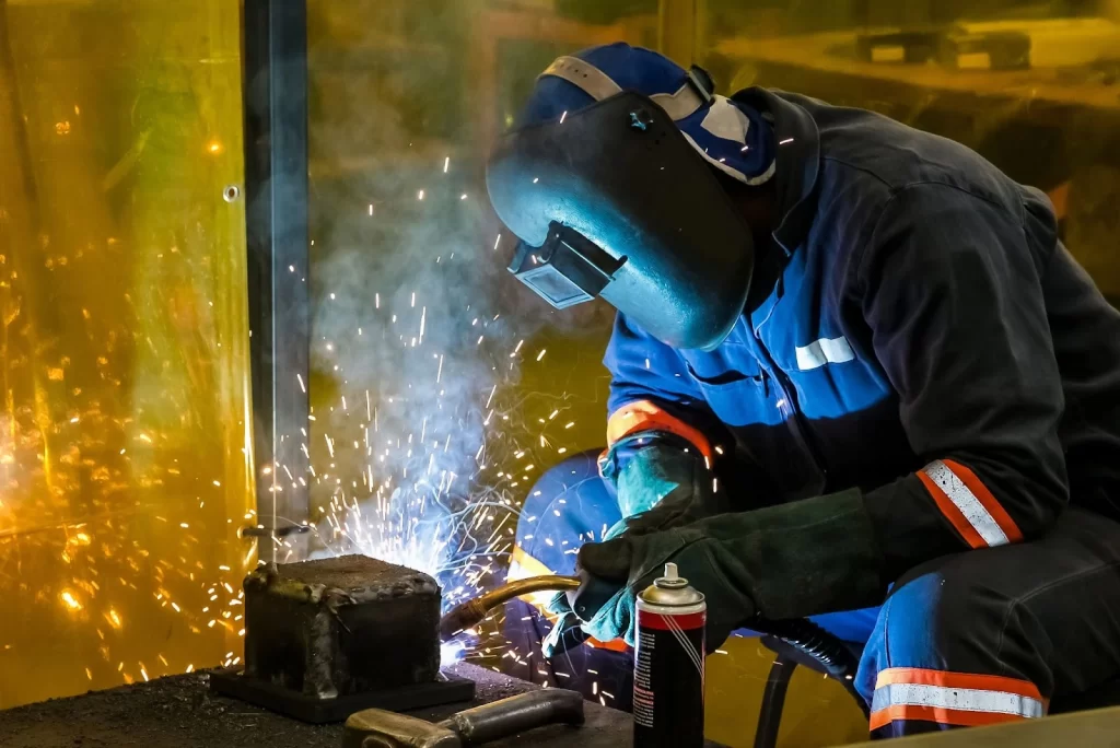 Male worker welding